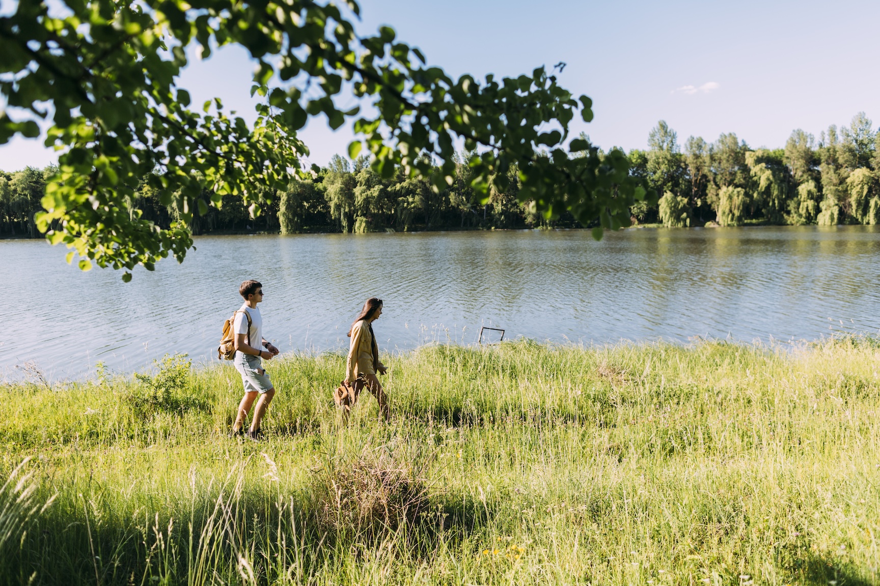Couple walking near the river